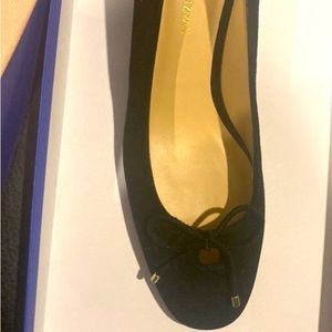 Black suede dress shoe with low heel. And bow to top it off!